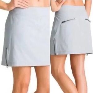 Athleta  skort with Zippers , stretchy, size 8 in Ivory/beige